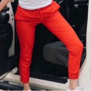 Brand new never worn ZYIA Red Zipper Joggers with tags and zippers at ankles.